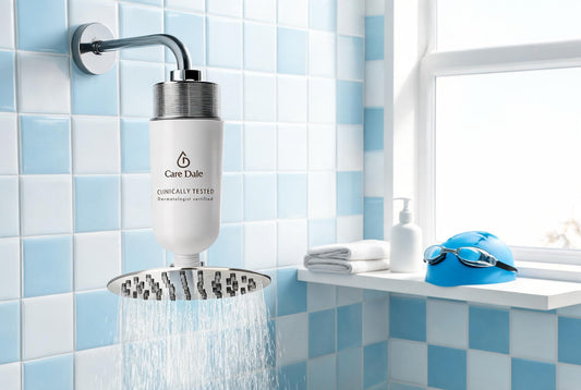 Care Dale filter on a running rain shower beside a shelf with a towel, moisturiser, swim cap and goggles