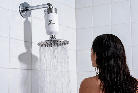 Care Dale shower filter fitted above a showerhead, reducing the hard water residue linked to scalp odour after washing
